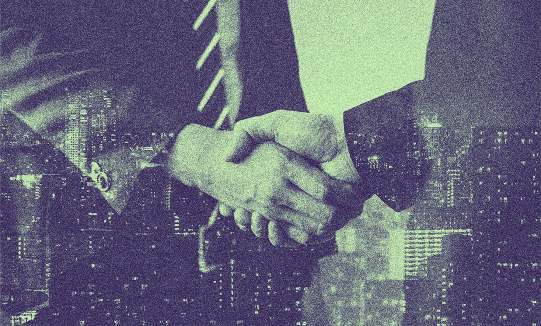 Two people shaking hands.