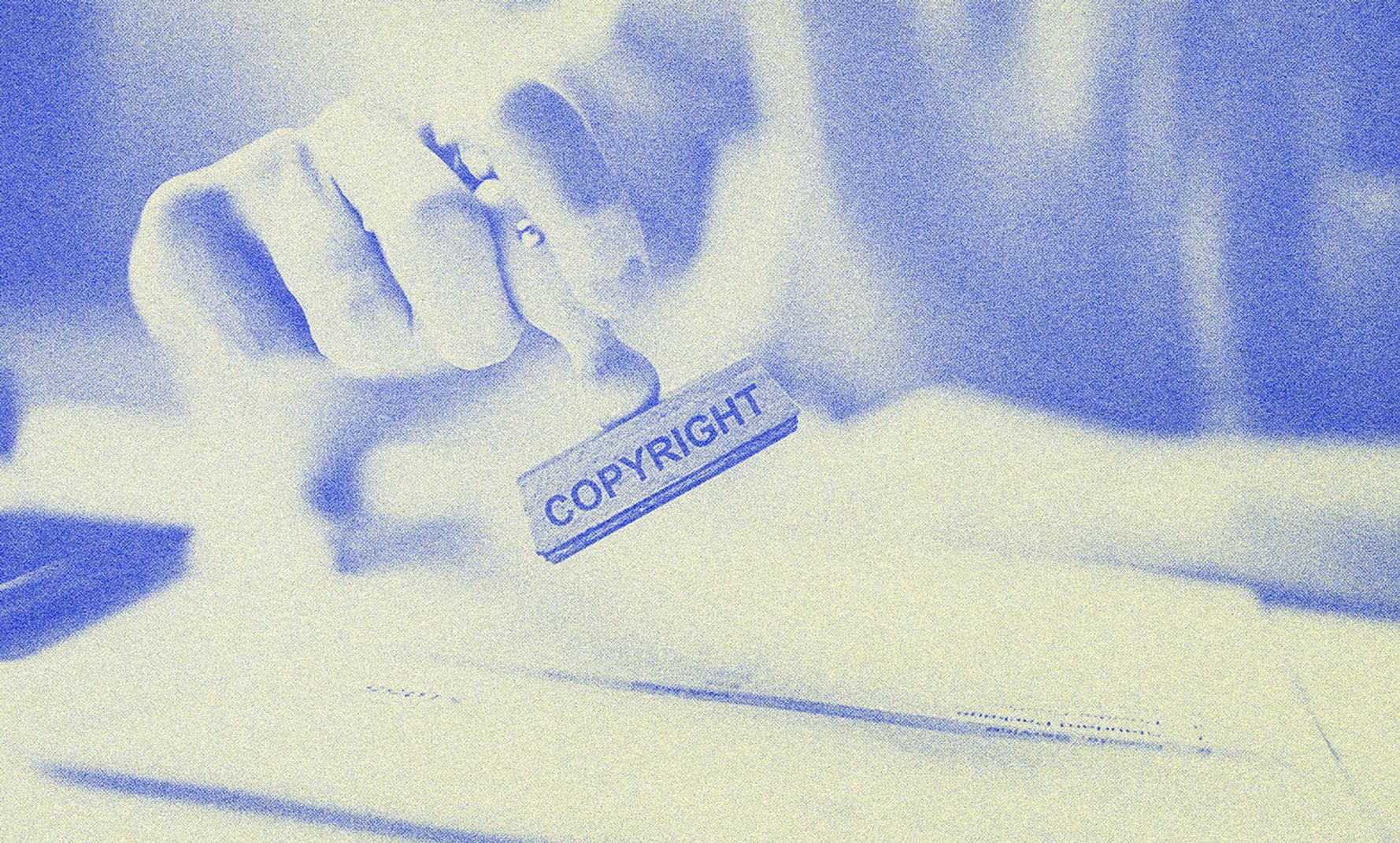 A person holding a stamp.