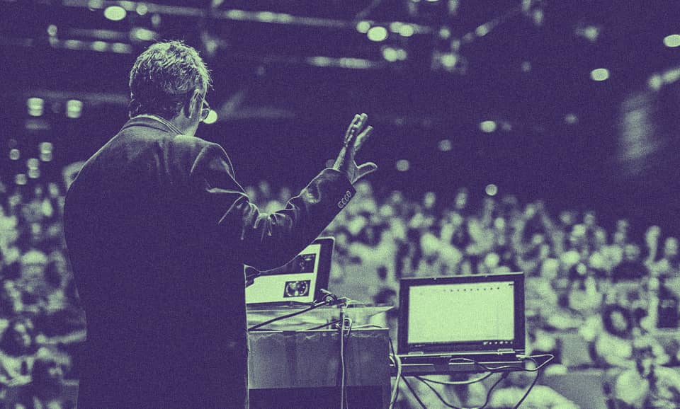 An academic lecturing a class.