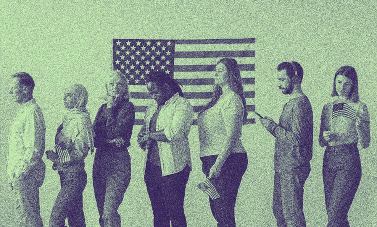 People in queue in front of a U.S. flag