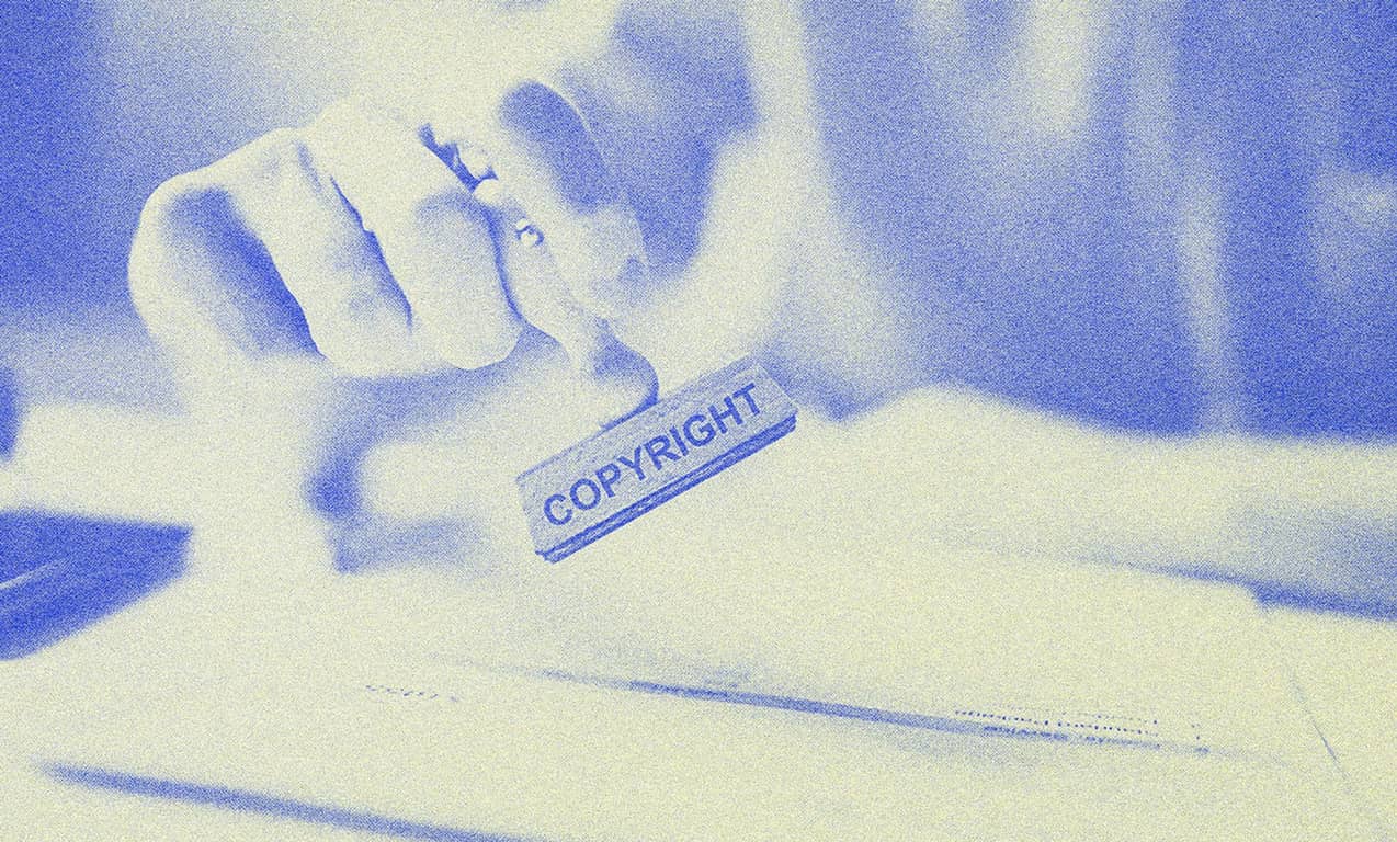 A person holding a stamp.