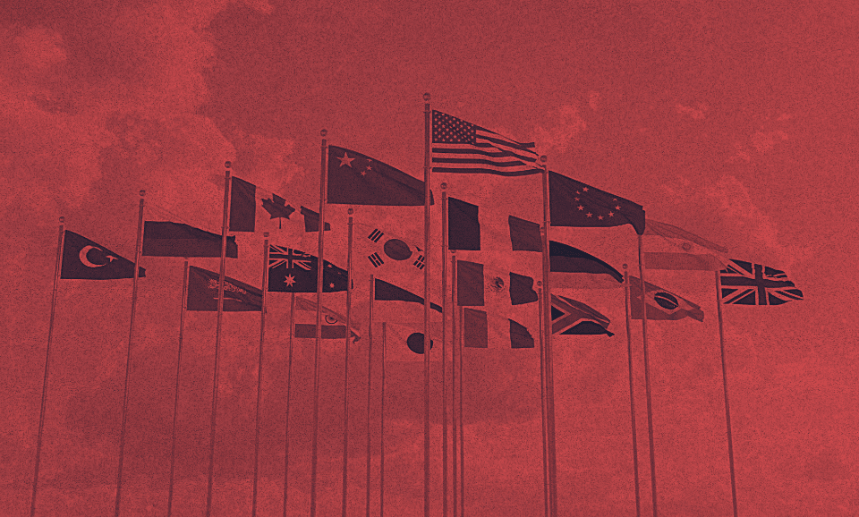 A group of flag poles together.