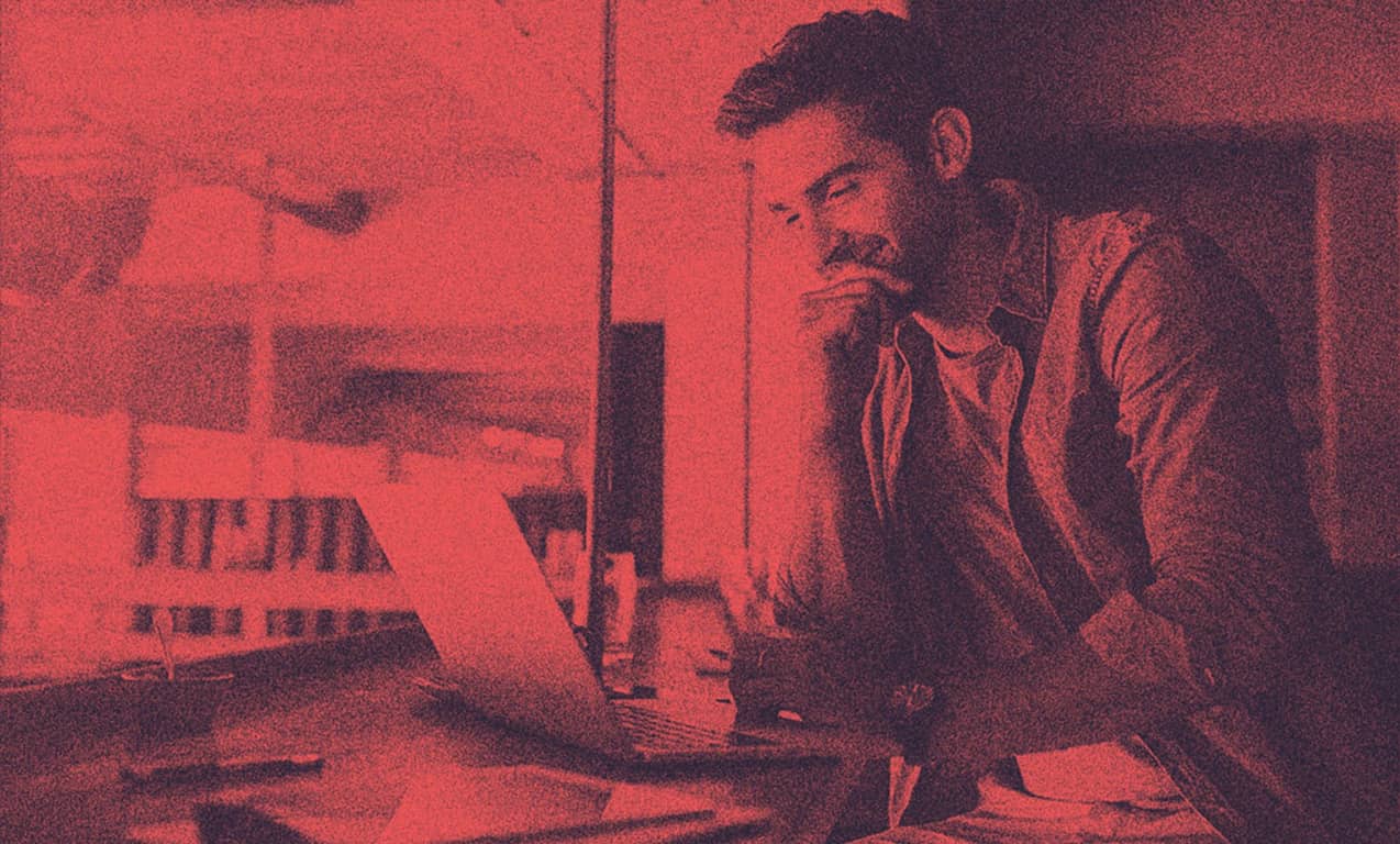 A man working on his laptop.