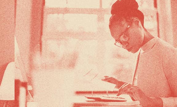 A woman doing calculations.