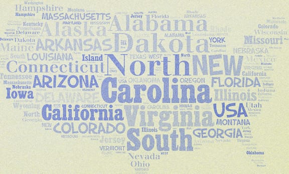 Names of various US states written on a piece of paper