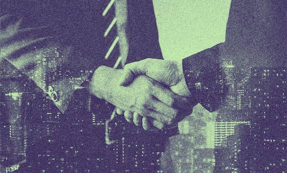 Two people shaking hands.