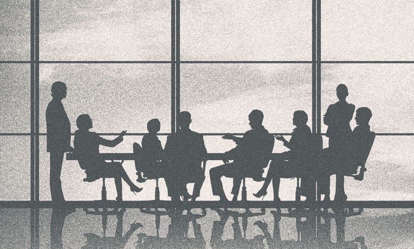 People in a meeting, only their silhouettes showing.