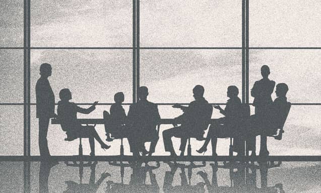 People in a meeting, only their silhouettes showing.