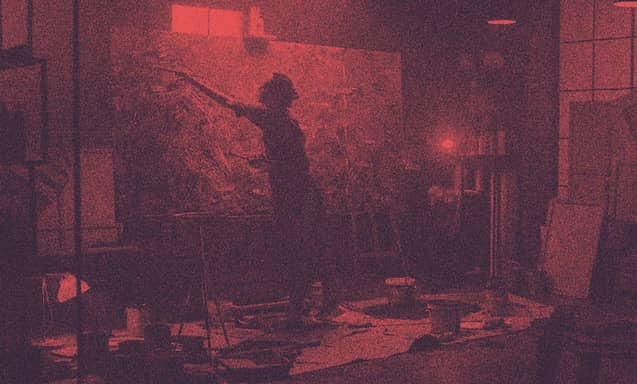 A painter paints a wide canvas.