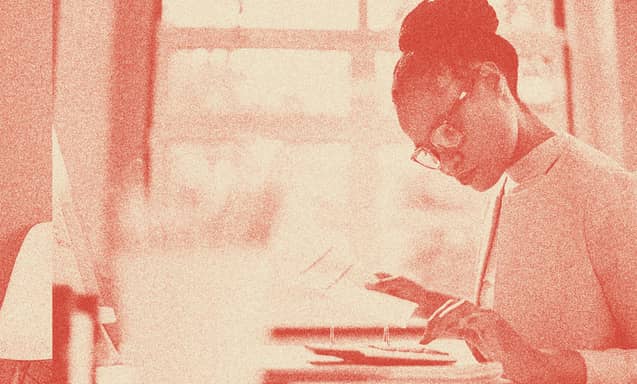 A woman doing calculations.