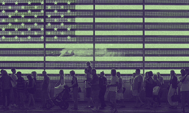 a group of people walking beside a screen with the U.S. flag projected on.