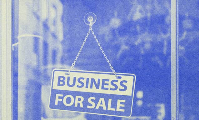 Front of a store with a sign on the glass door.