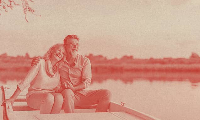 An old couple sailing on a kayak