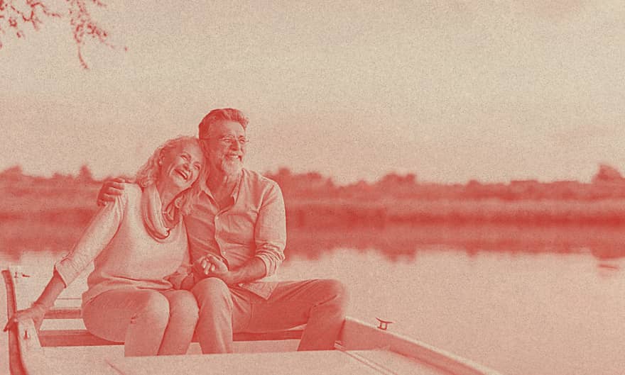 An old couple sailing on a kayak