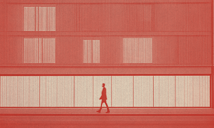 A person walks in front of a building